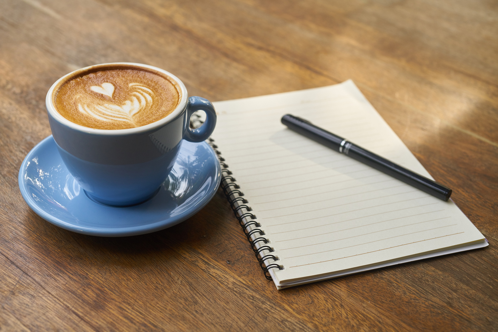 Coffee and Notebook on a Desk